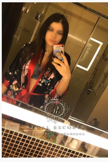 Bia in kimono dress taking selfie in mirror 